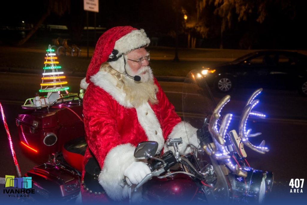 Santa turns his helmet into a custom Santa hat.